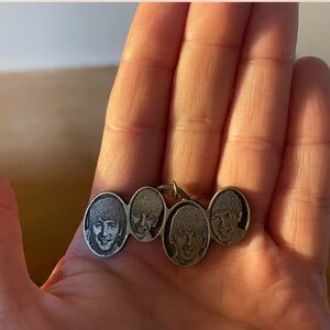 Silver Oval Pendant with Engraved Faces